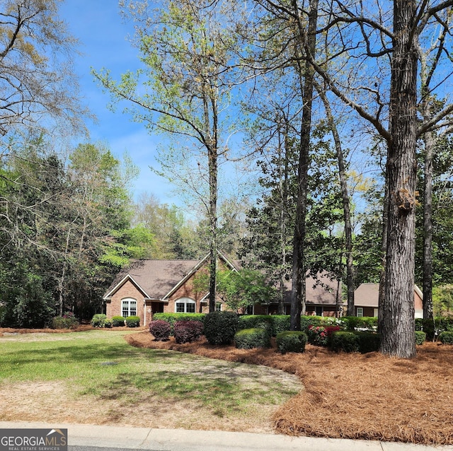 213 Falcon Crst, Warner Robins, GA 31088 - view of front of house with a front lawn and brick siding