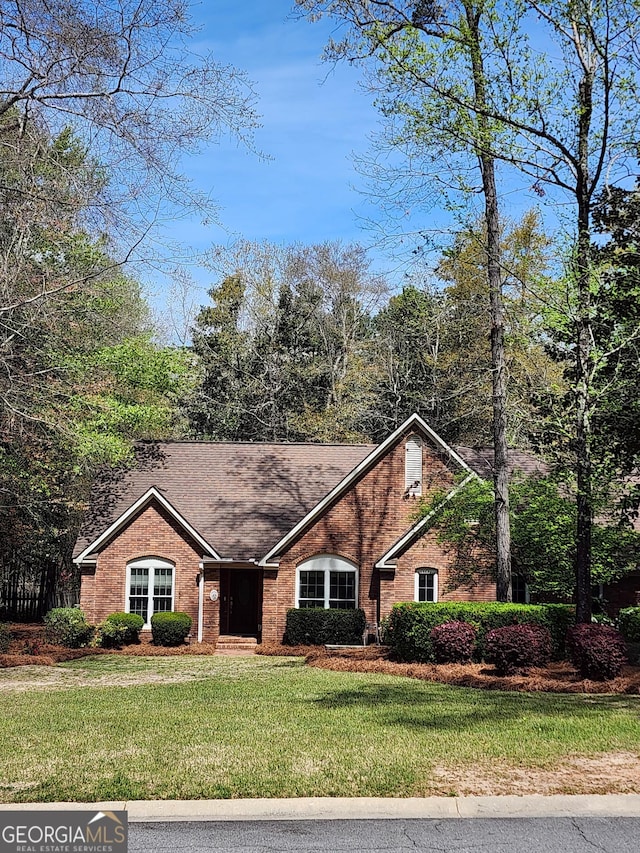213 Falcon Crst, Warner Robins, GA 31088 - view of front of home with brick siding and a front yard