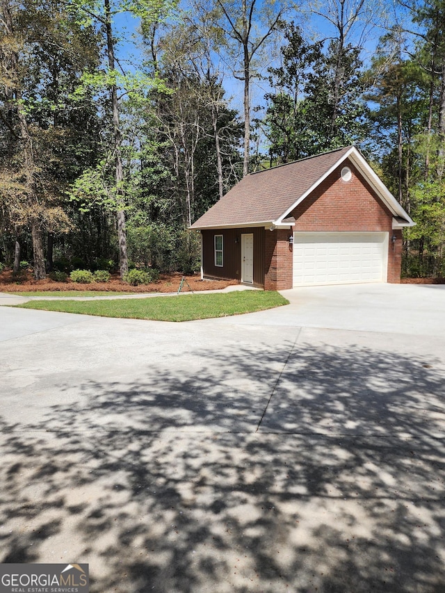 213 Falcon Crst, Warner Robins, GA 31088 - view of front of home featuring driveway, brick siding, and a garage