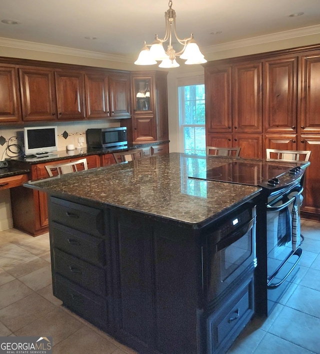 213 Falcon Crst, Warner Robins, GA 31088 - kitchen featuring stainless steel microwave, black range with electric stovetop, light tile patterned floors, a chandelier, and dark stone countertops