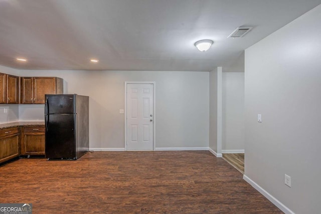 1808 Arkose Dr SE, Atlanta, GA 30316 - kitchen featuring freestanding refrigerator, baseboards, dark wood finished floors, recessed lighting, and brown cabinets