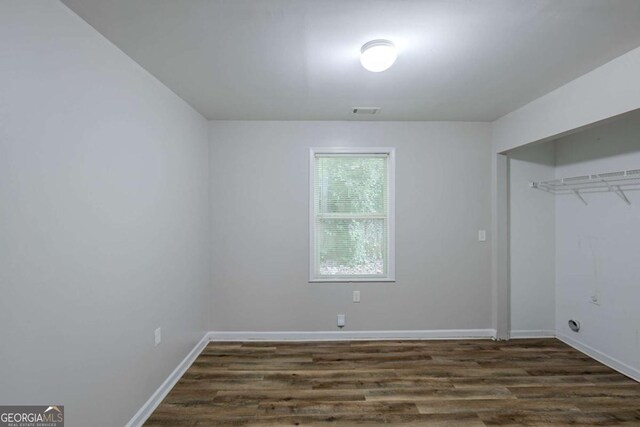 1808 Arkose Dr SE, Atlanta, GA 30316 - unfurnished bedroom with dark wood-style flooring, baseboards, and a closet