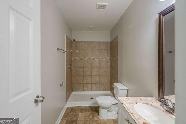 1808 Arkose Dr SE, Atlanta, GA 30316 - bathroom with vanity, toilet, and a tile shower