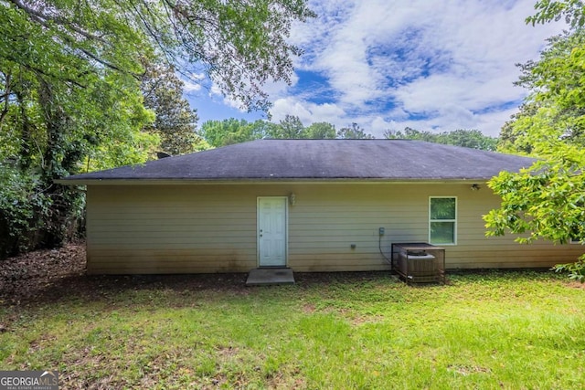 1808 Arkose Dr SE, Atlanta, GA 30316 - back of house featuring a lawn and central AC unit