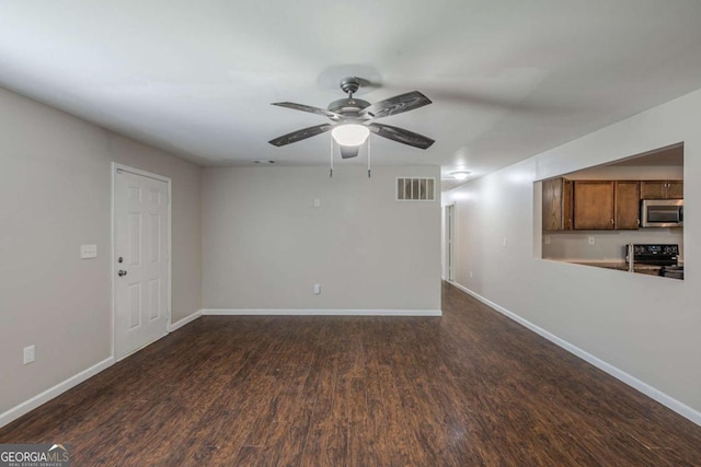 1808 Arkose Dr SE, Atlanta, GA 30316 - unfurnished living room with ceiling fan, baseboards, and dark wood-style floors