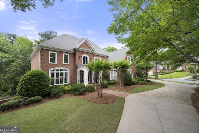 2743 Long Grove Dr, Marietta, GA 30062 - colonial home with brick siding, a front yard, and curved driveway