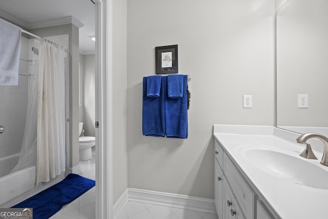 2743 Long Grove Dr, Marietta, GA 30062 - full bath featuring baseboards, tile patterned flooring, vanity, toilet, and crown molding