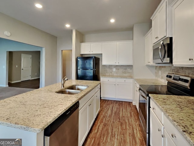 9 Holsteiner, Dallas, GA 30132 - kitchen featuring stainless steel appliances, a sink, white cabinetry, and recessed lighting