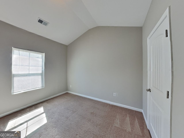 9 Holsteiner, Dallas, GA 30132 - spare room with vaulted ceiling, carpet, and baseboards