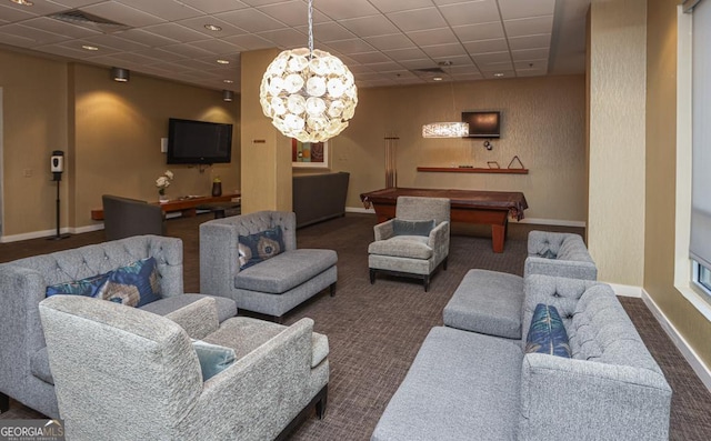 living room with carpet floors, a drop ceiling, baseboards, billiards table, and a chandelier