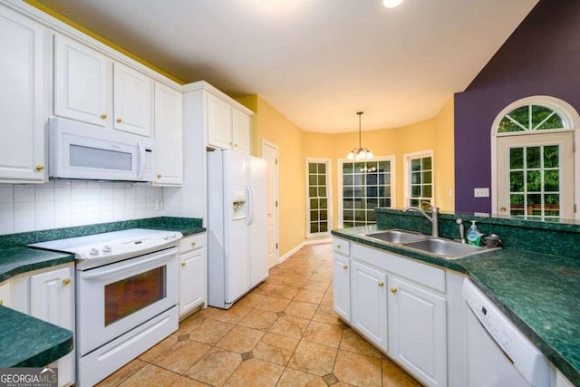 2430 Harbin Springs Cv, Dacula, GA 30019 - kitchen featuring white appliances, a sink, white cabinetry, dark countertops, and decorative light fixtures