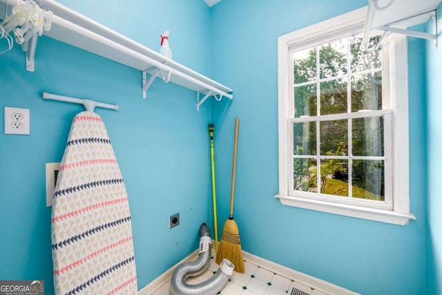 2430 Harbin Springs Cv, Dacula, GA 30019 - laundry room with electric dryer hookup, baseboards, and tile patterned floors