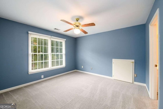 2430 Harbin Springs Cv, Dacula, GA 30019 - empty room with ceiling fan, carpet, and baseboards
