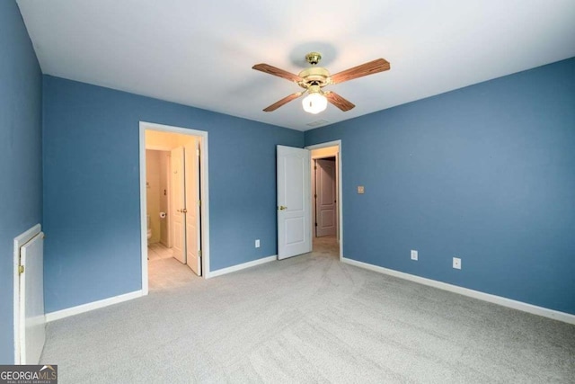 2430 Harbin Springs Cv, Dacula, GA 30019 - unfurnished bedroom featuring baseboards, carpet floors, ceiling fan, and ensuite bathroom