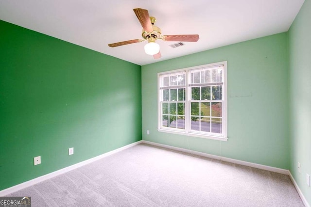 2430 Harbin Springs Cv, Dacula, GA 30019 - spare room featuring carpet flooring, baseboards, and ceiling fan