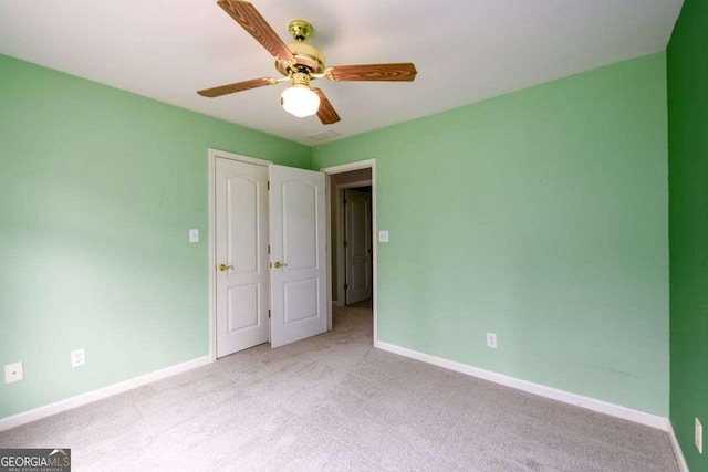 2430 Harbin Springs Cv, Dacula, GA 30019 - unfurnished bedroom featuring carpet flooring, baseboards, and ceiling fan
