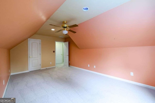 2430 Harbin Springs Cv, Dacula, GA 30019 - additional living space with light carpet, vaulted ceiling, baseboards, and ceiling fan