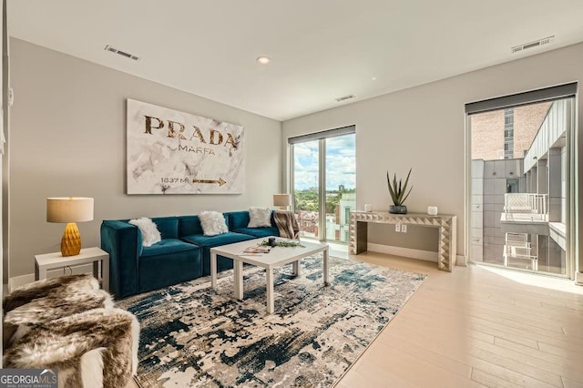 775 Juniper St NE Unit 612, Atlanta, GA 30308 - living room featuring wood finished floors, recessed lighting, and baseboards