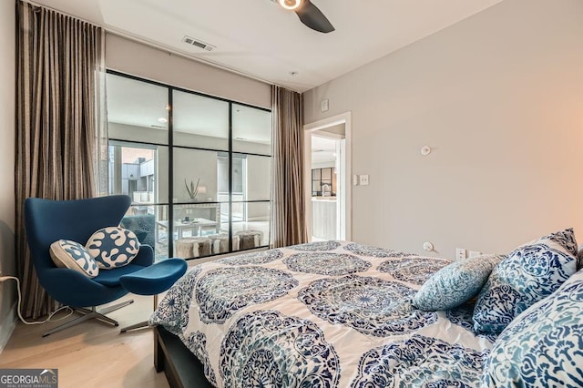 775 Juniper St NE Unit 612, Atlanta, GA 30308 - bedroom featuring wood finished floors and ceiling fan