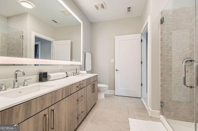 775 Juniper St NE Unit 612, Atlanta, GA 30308 - full bathroom with a shower stall, tile patterned flooring, double vanity, toilet, and baseboards