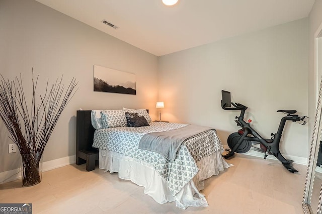 775 Juniper St NE Unit 612, Atlanta, GA 30308 - bedroom featuring baseboards and wood finished floors