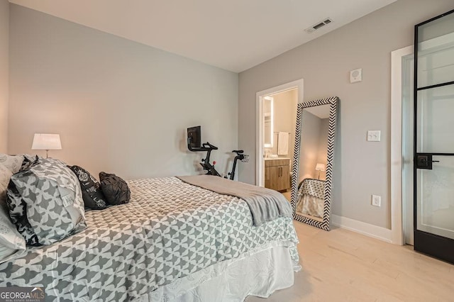 775 Juniper St NE Unit 612, Atlanta, GA 30308 - bedroom featuring light wood finished floors and baseboards