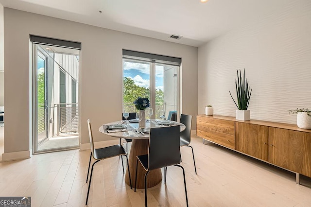 775 Juniper St NE Unit 612, Atlanta, GA 30308 - dining area with light wood-style floors and baseboards