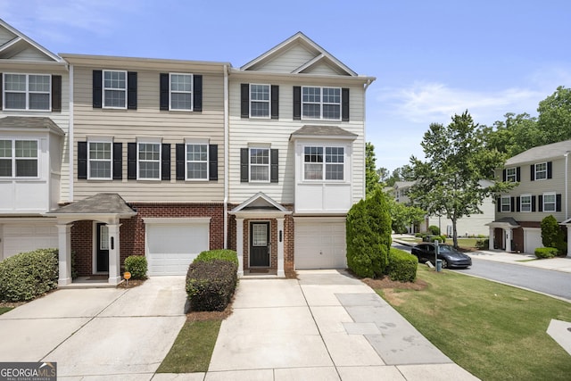 multi unit property with brick siding, concrete driveway, and an attached garage