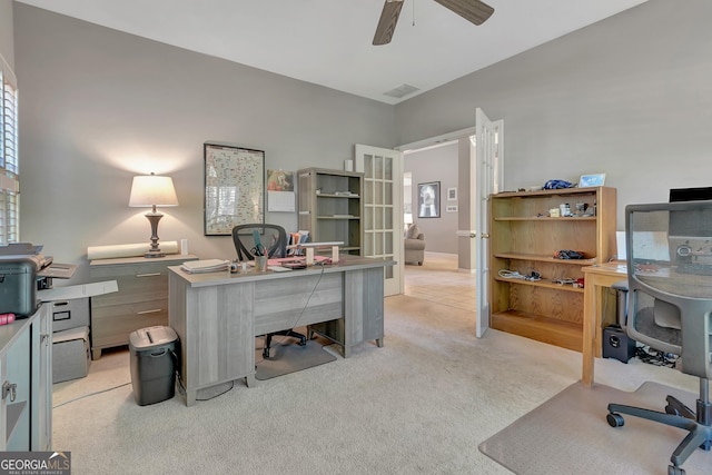 office area with ceiling fan and light carpet