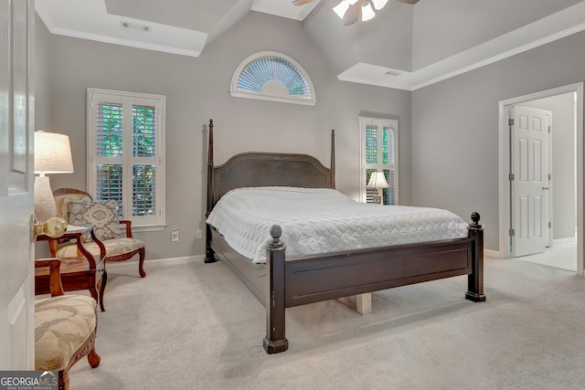 bedroom featuring light carpet, baseboards, crown molding, and a ceiling fan