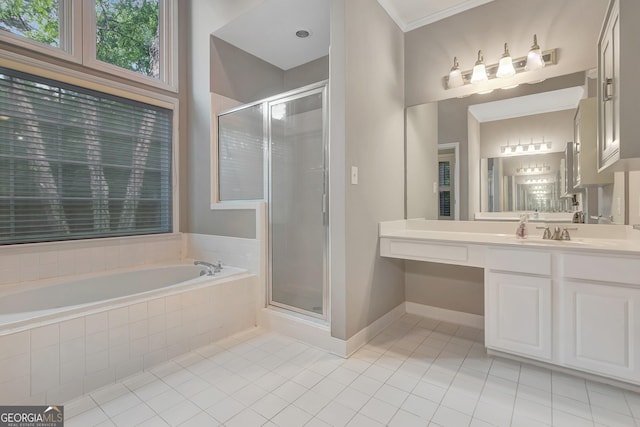 full bath featuring tile patterned flooring, a stall shower, a garden tub, vanity, and ornamental molding