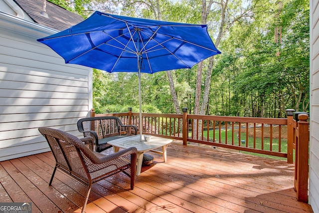 wooden terrace with view of scattered trees