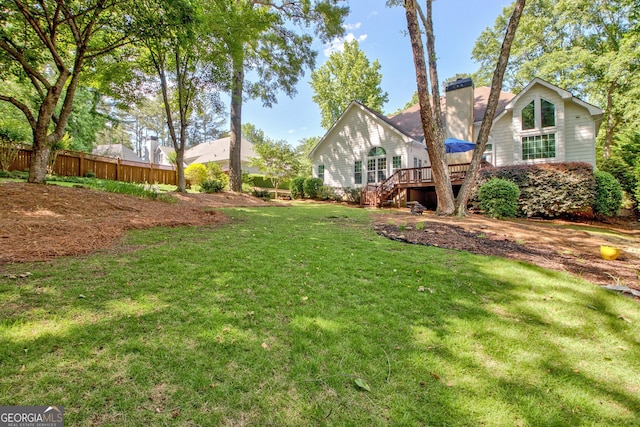 view of yard featuring a deck and stairs