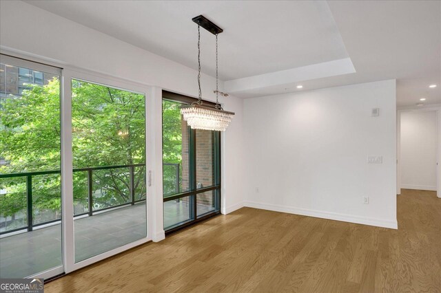 867 Peachtree St NE Unit 202, Atlanta, GA 30308 - spare room with ceiling fan, healthy amount of natural light, baseboards, and wood finished floors