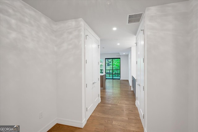 867 Peachtree St NE Unit 202, Atlanta, GA 30308 - hallway featuring baseboards and wood finished floors