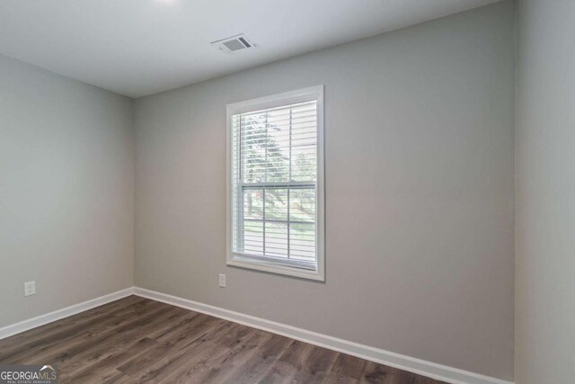 233 Clayton St, Fairburn, GA 30213 - unfurnished room with plenty of natural light and dark wood-style floors