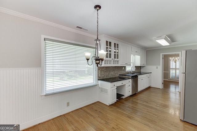 402 Johannah Pl SW, Lilburn, GA 30047 - kitchen with a chandelier, freestanding refrigerator, dark countertops, light wood-style floors, and white cabinetry