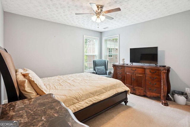 4549 Clarks Creek Ter, Ellenwood, GA 30294 - bedroom with light colored carpet, ceiling fan, and a textured ceiling