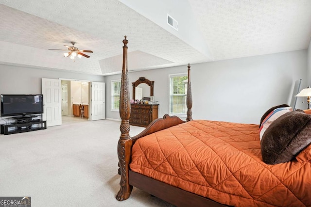 4549 Clarks Creek Ter, Ellenwood, GA 30294 - carpeted bedroom featuring a textured ceiling, ensuite bath, a ceiling fan, and baseboards