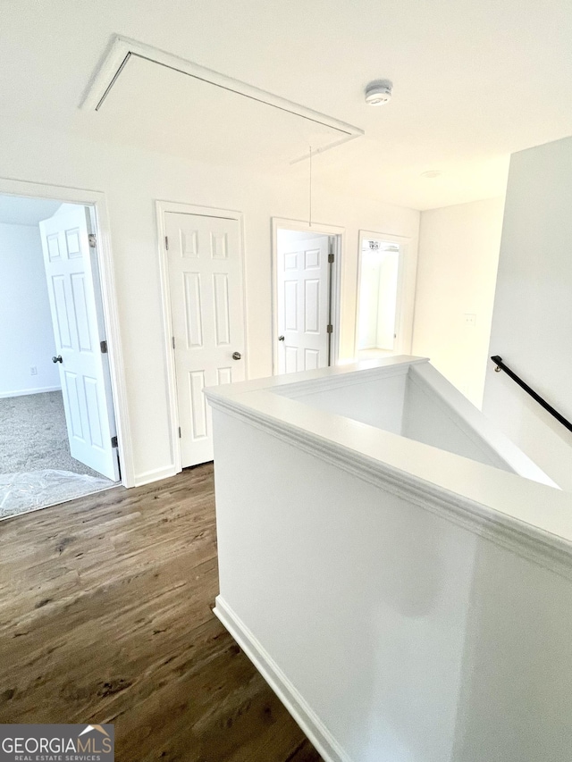 25 Harriet Dr, Lavonia, GA 30553 - hall with attic access, dark wood-type flooring, and baseboards
