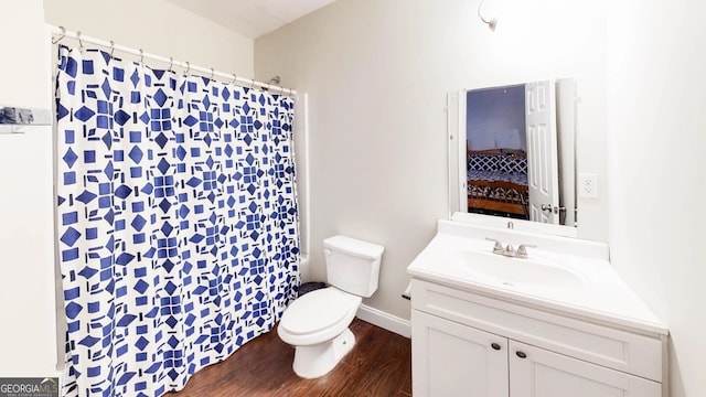 117 Joseph E Lowery Blvd NW, Atlanta, GA 30314 - bathroom with wood finished floors, toilet, vanity, and a shower with curtain