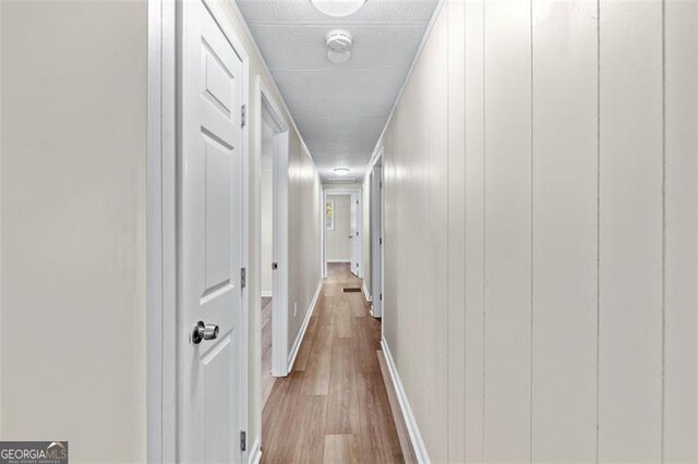 610 Ash Ln, Monroe, GA 30655 - hallway featuring wood finished floors and baseboards