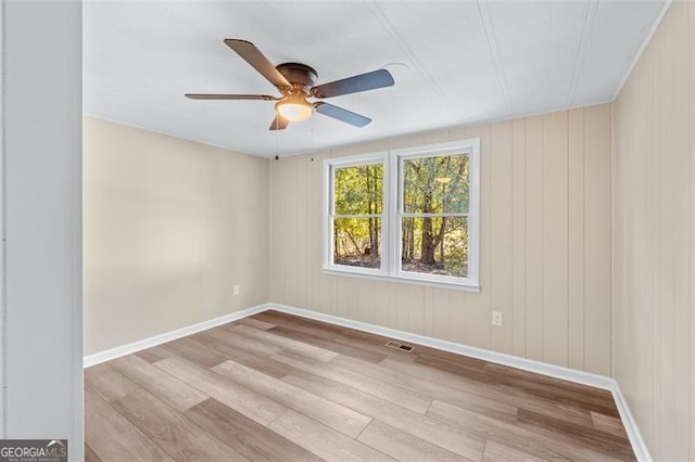 610 Ash Ln, Monroe, GA 30655 - empty room with wood finished floors, ceiling fan, and baseboards