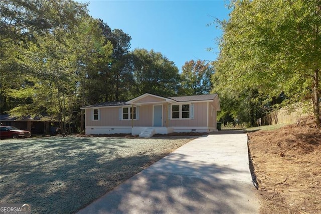 610 Ash Ln, Monroe, GA 30655 - view of front of home with crawl space, driveway, and covered porch