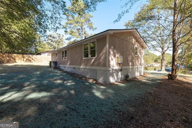 610 Ash Ln, Monroe, GA 30655 - view of property exterior with crawl space, fence, and central AC