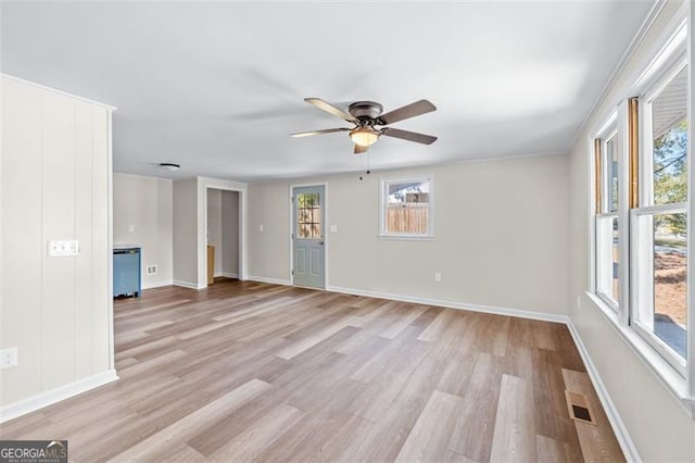 610 Ash Ln, Monroe, GA 30655 - empty room featuring light wood finished floors, ceiling fan, and baseboards