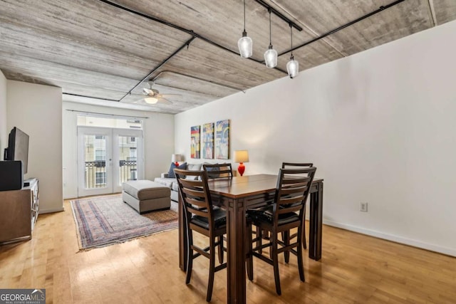 800 Peachtree St NE Unit 2304, Atlanta, GA 30308 - dining space featuring french doors, wood finished floors, and ceiling fan