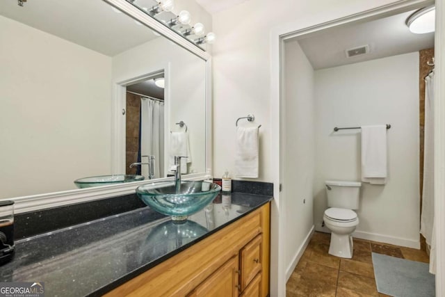 800 Peachtree St NE Unit 2304, Atlanta, GA 30308 - bathroom featuring vanity, tile patterned flooring, and a shower with curtain