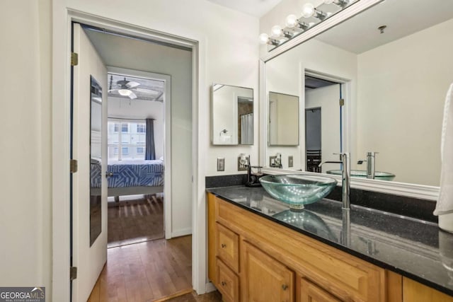 800 Peachtree St NE Unit 2304, Atlanta, GA 30308 - full bathroom featuring vanity, hardwood / wood-style floors, ensuite bath, and a ceiling fan