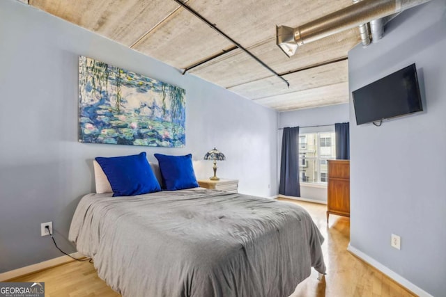 800 Peachtree St NE Unit 2304, Atlanta, GA 30308 - bedroom with wood finished floors